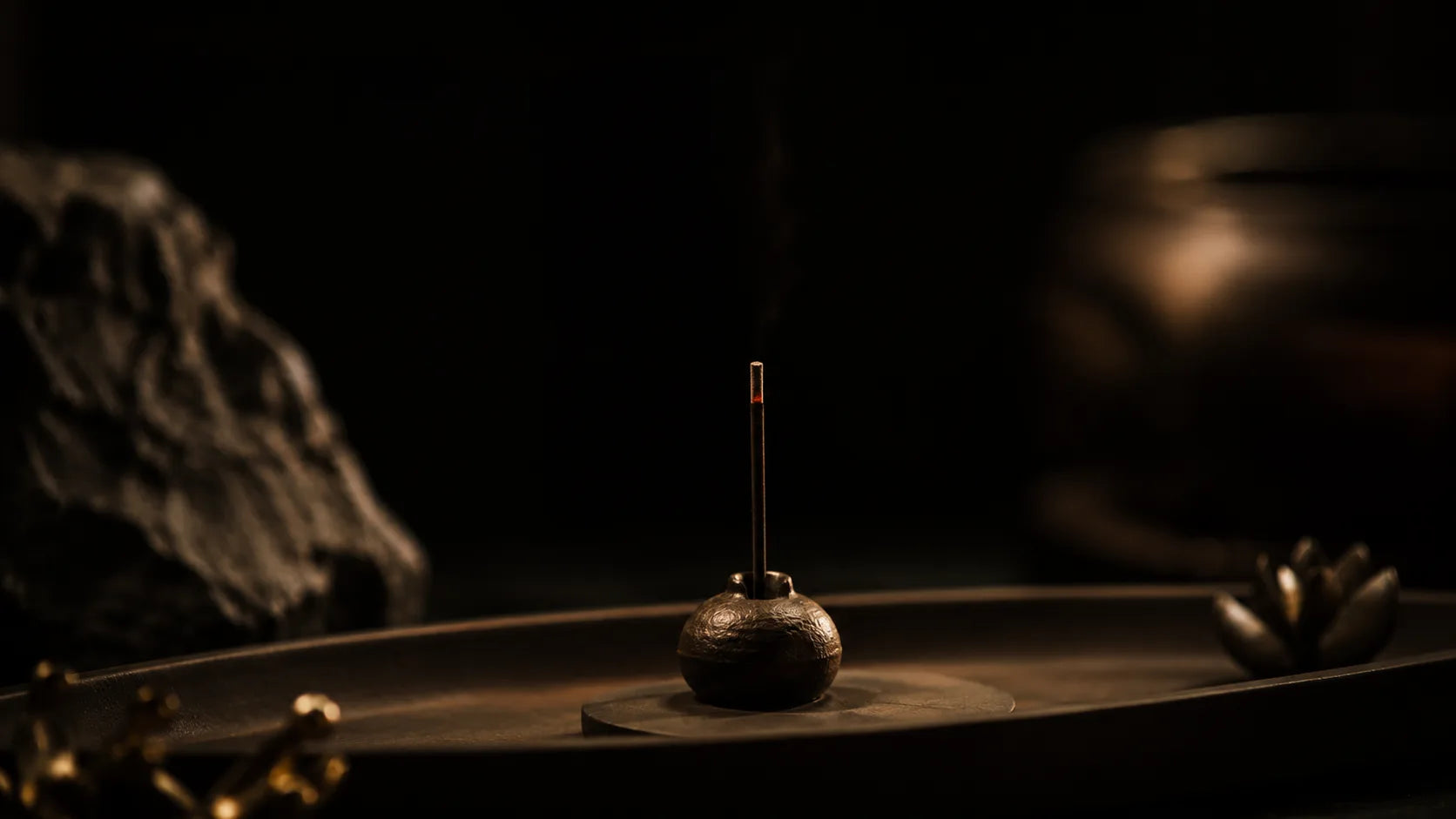 Incense burning in a dark interior