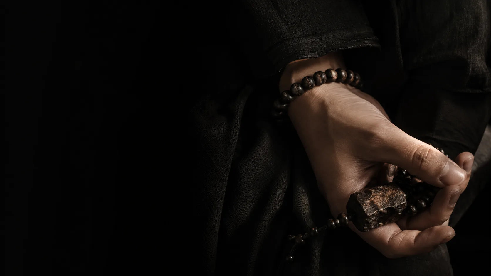 A Dao Origin pendant worn close to the body